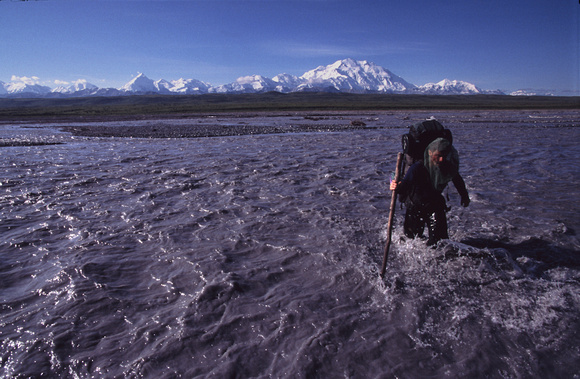 Climber crossing Mckinley river.